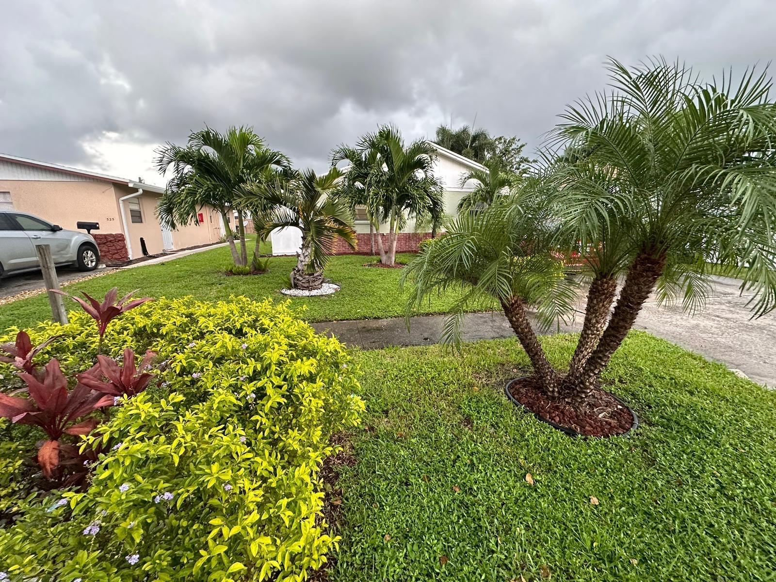 523 Colonial Road, Unit A B West Palm Beach, FL 33405 - Photo 10 of 11 a view of a garden with a flower in a garden
