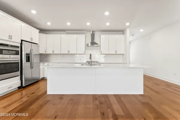 a view of kitchen with wooden floor
