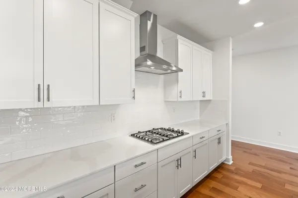 a kitchen with cabinets and appliances
