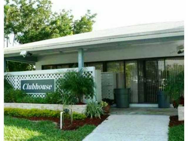 567 Trace Circle, Unit 110 Deerfield Beach, FL 33441 - Photo 2 of 8 a view of a back yard
