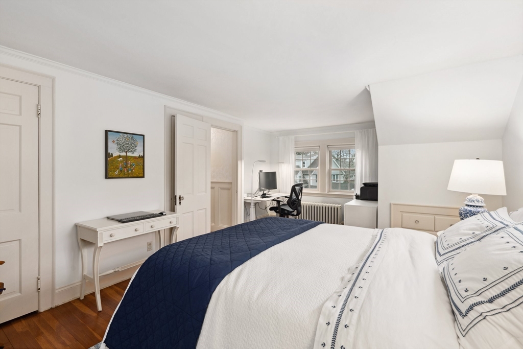 12 Cherry Lane Dedham, MA 02026 - Photo 23 of 37 a bedroom with a bed and wooden floor