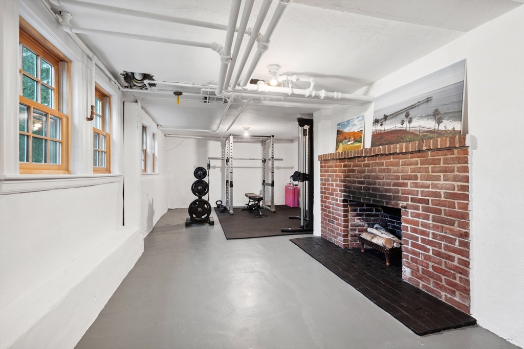 12 Cherry Lane Dedham, MA 02026 - Photo 30 of 37 a view of a hallway with workspace and a window