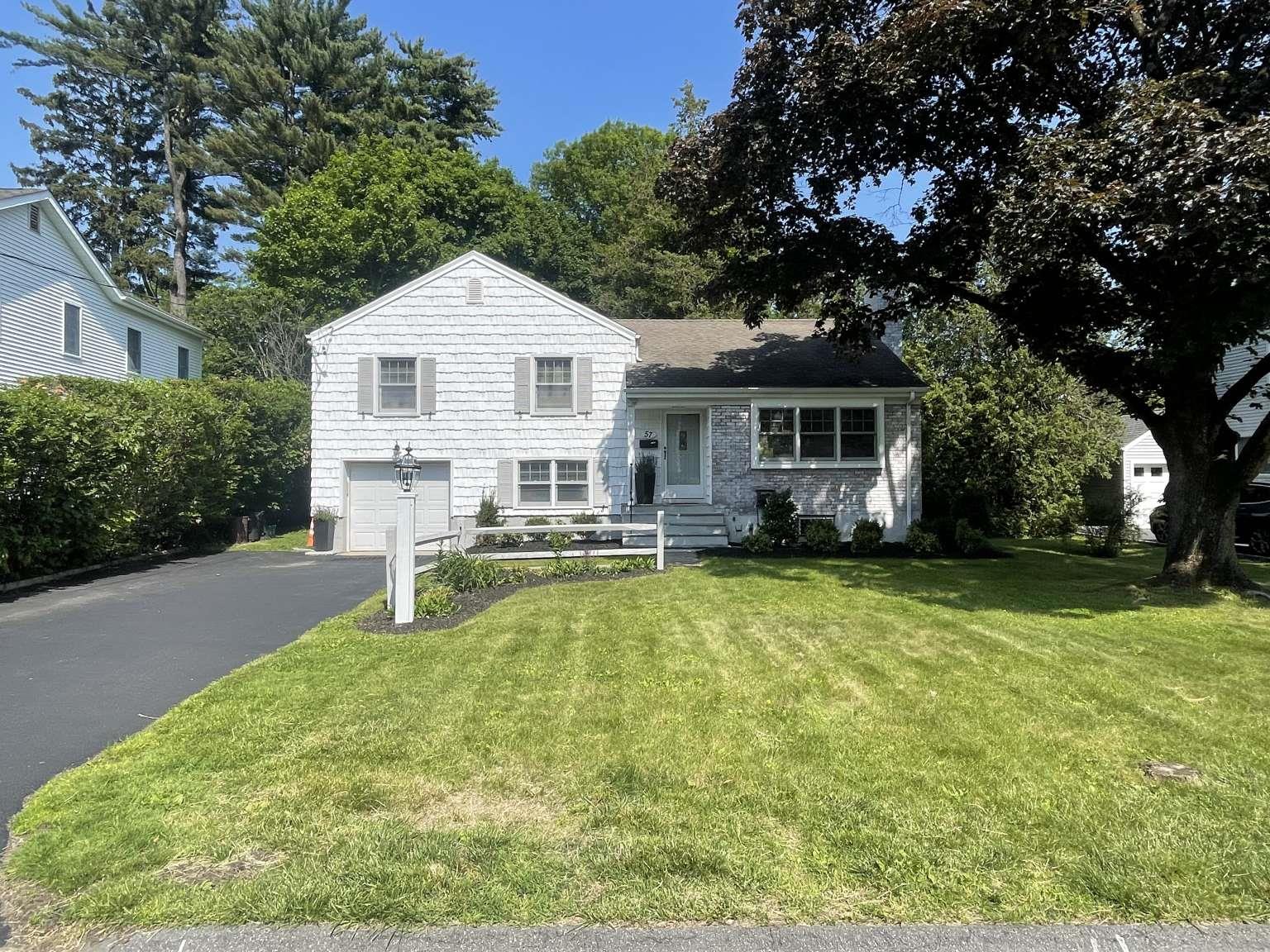 57 Valley Terrace Rye Brook, NY 10573 - Photo 1 of 1 a view of a house with a yard patio and fire pit