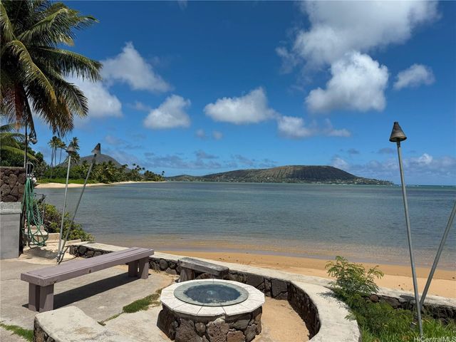 a view of a outdoor sitting area with swimming pool