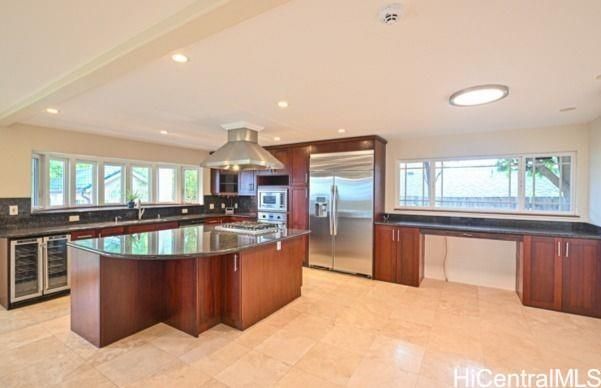a view of a living room and kitchen with a large window