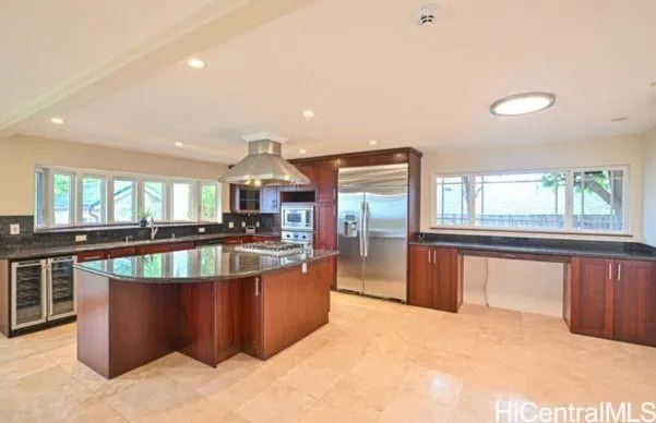 a view of a living room and kitchen with a large window