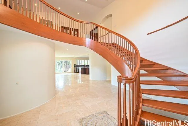a view of entryway and hall with wooden floor