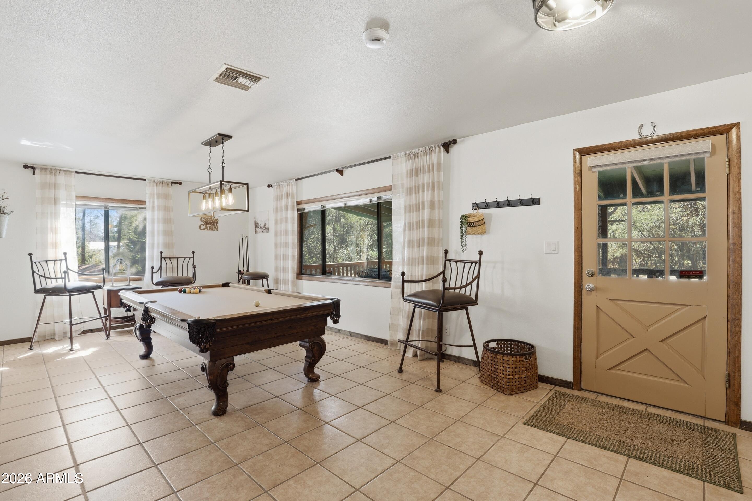 6740 Ridge Road Pine, AZ 85544 - Photo 19 of 35 a view of a workspace with furniture and a potted plant