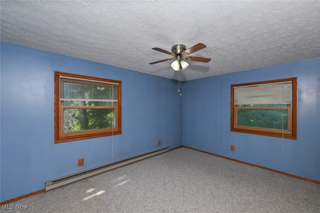 3079 Stroup Road Atwater, OH 44201 - Photo 24 of 40 Welcome to 3079 Stroup Rd, Atwater, OH 44201-9105 - The large master bedroom with windows overlooking the back and side yards.