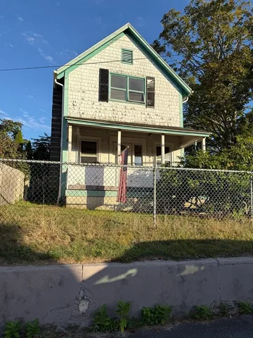a front view of a house with garage