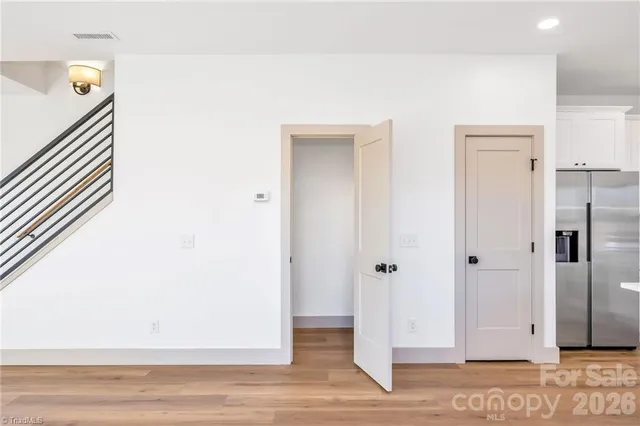 a view of a livingroom and wooden floor