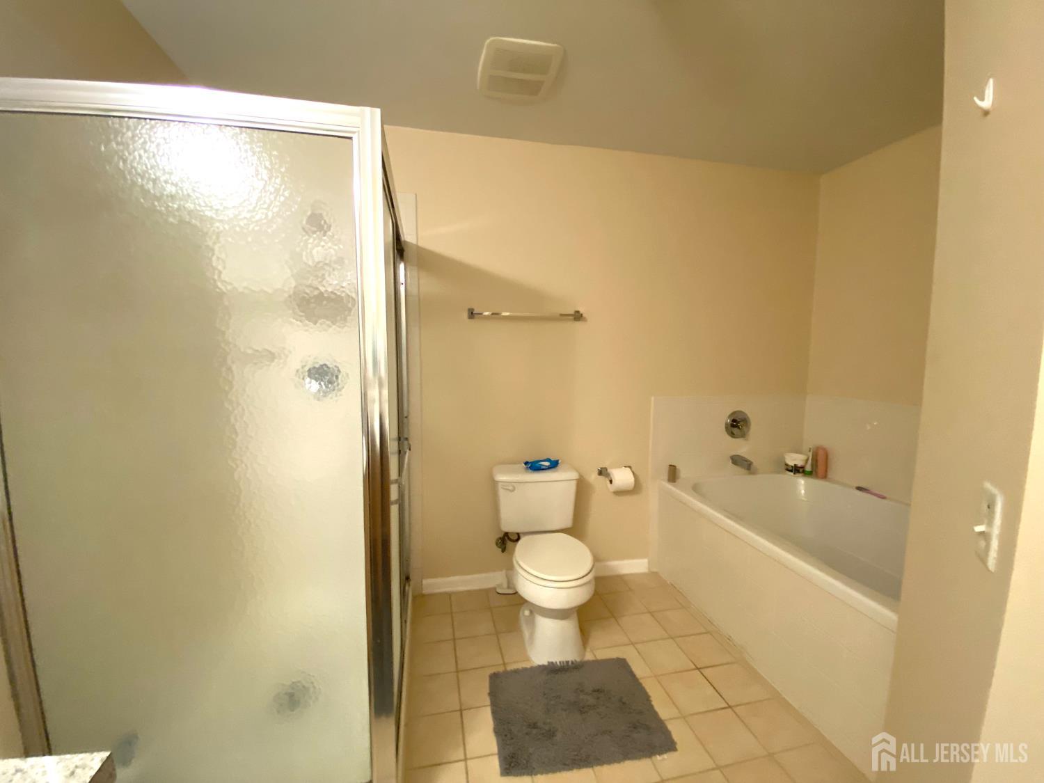 228 Hawthorne Road North Brunswick, NJ 08902 - Photo 11 of 23 a bathroom with a granite countertop bathtub shower and toilet