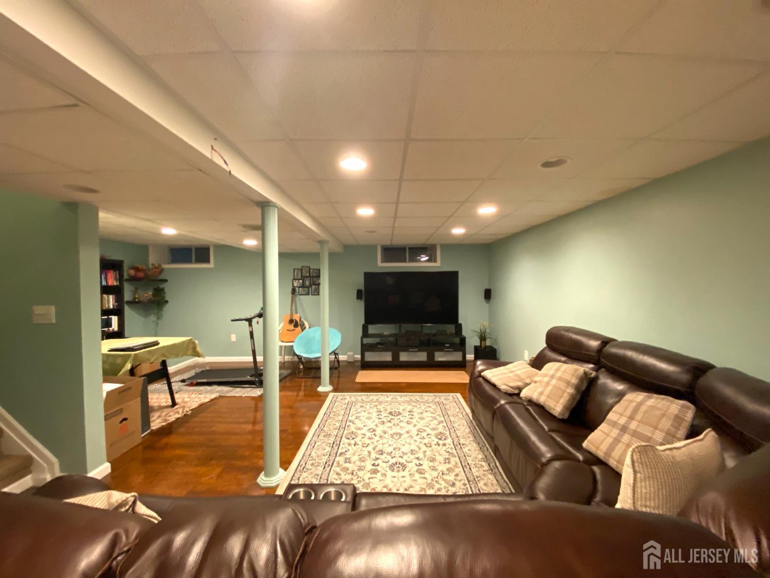 228 Hawthorne Road North Brunswick, NJ 08902 - Photo 19 of 23 a living room with furniture and a flat screen tv