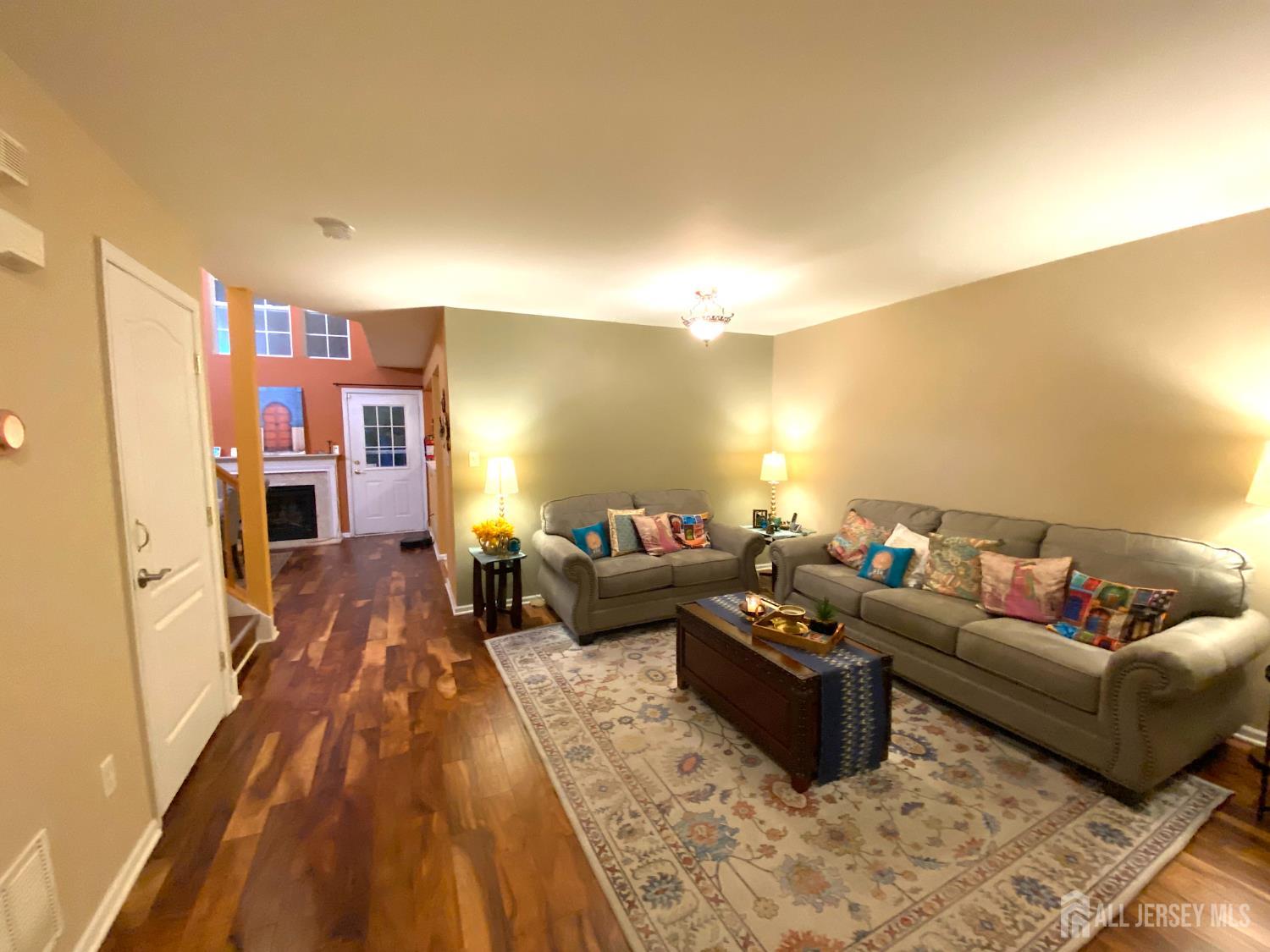 228 Hawthorne Road North Brunswick, NJ 08902 - Photo 2 of 23 a living room with furniture and a couch
