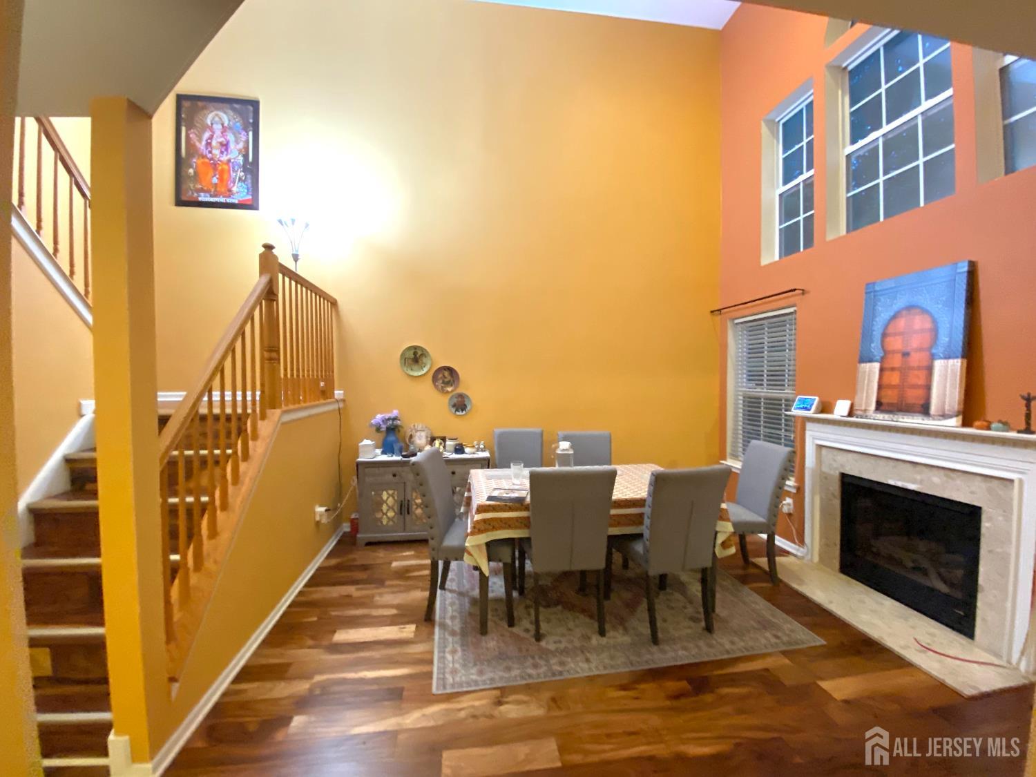 228 Hawthorne Road North Brunswick, NJ 08902 - Photo 6 of 23 a view of a patio with dining table and chairs with wooden floor