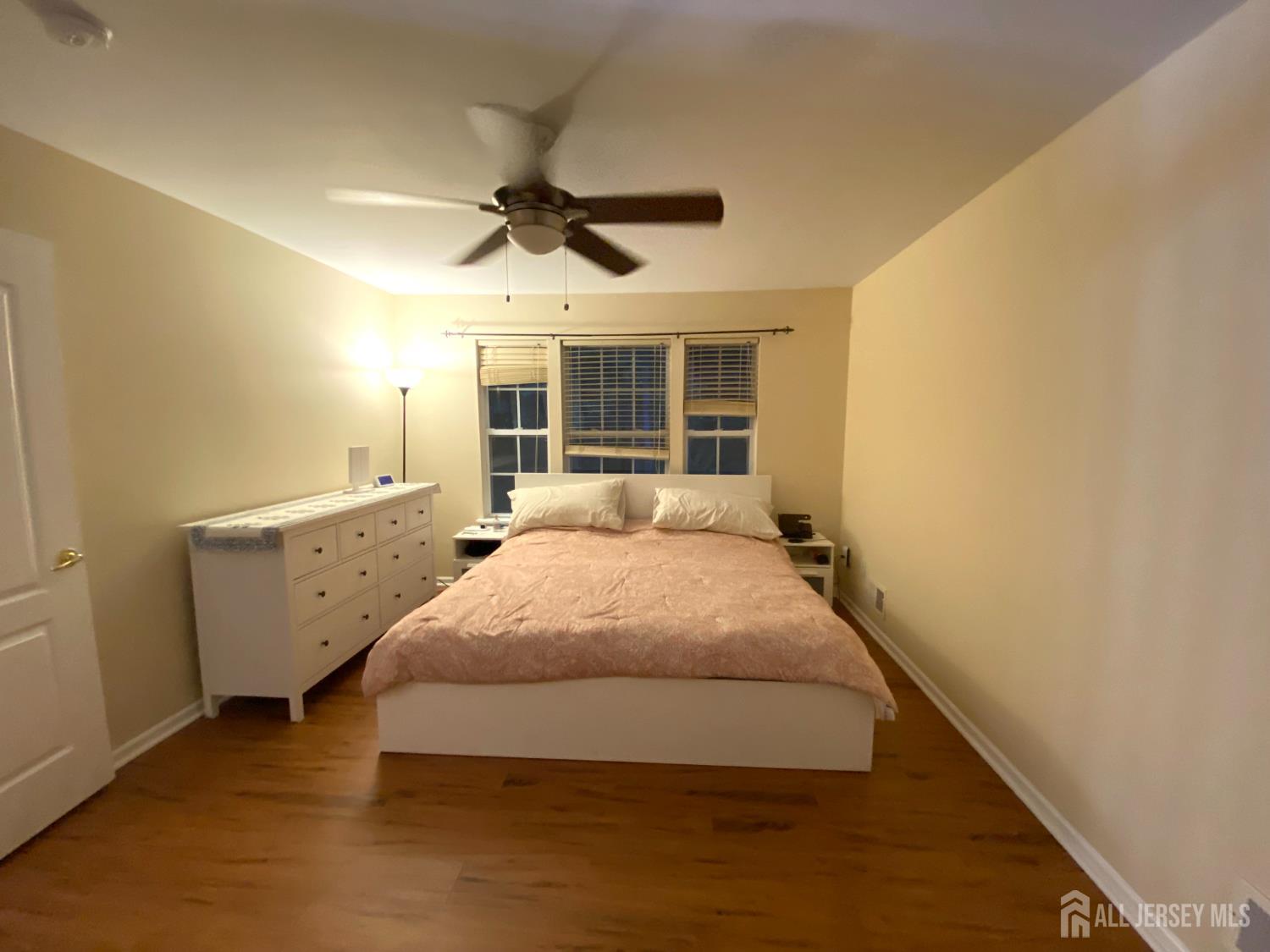 228 Hawthorne Road North Brunswick, NJ 08902 - Photo 10 of 23 a bed room with a bed and a large window