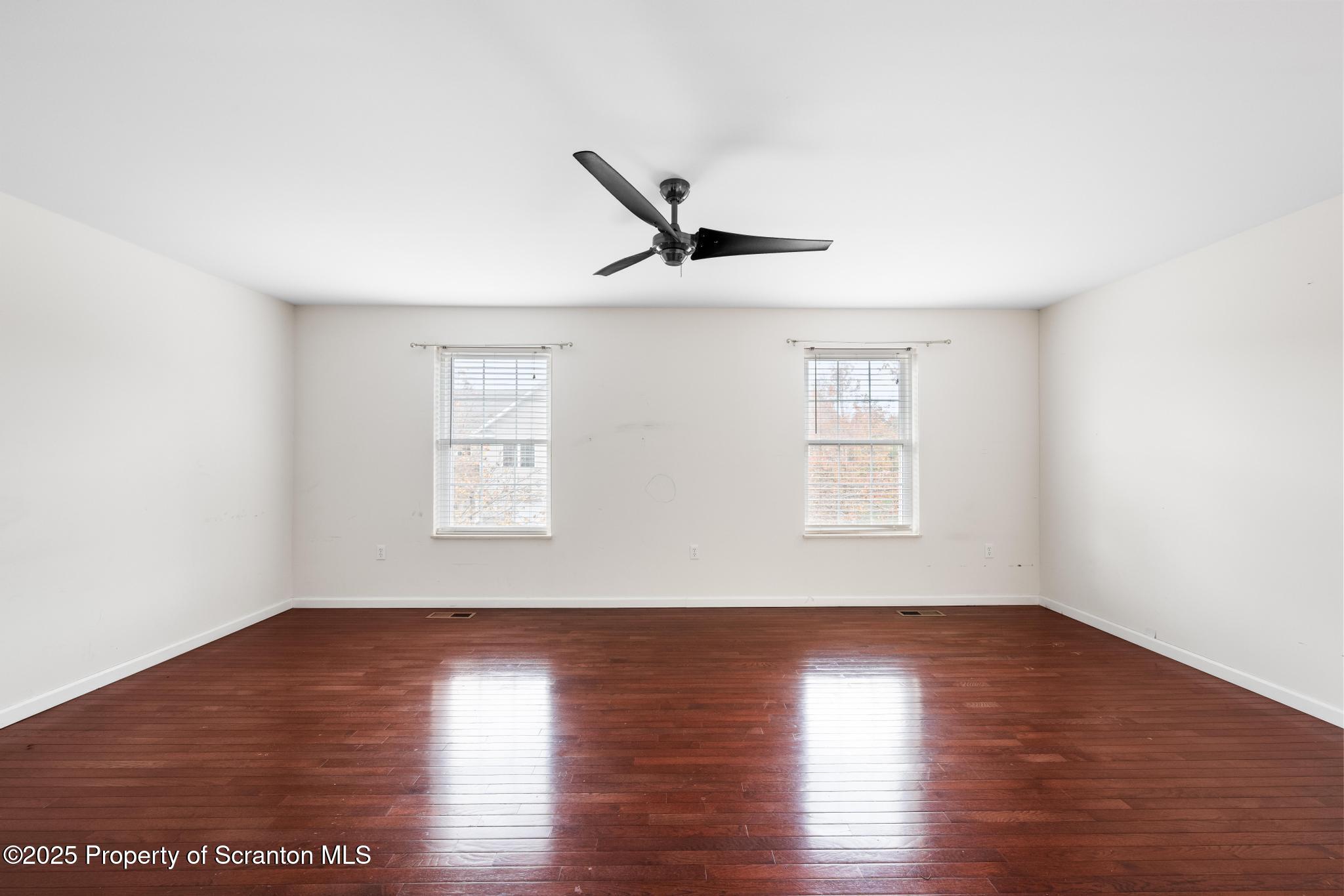 192 Shadow Wood Circle Archbald, PA 18403 - Photo 32 of 55 a view of room with hardwood floor and a ceiling fan