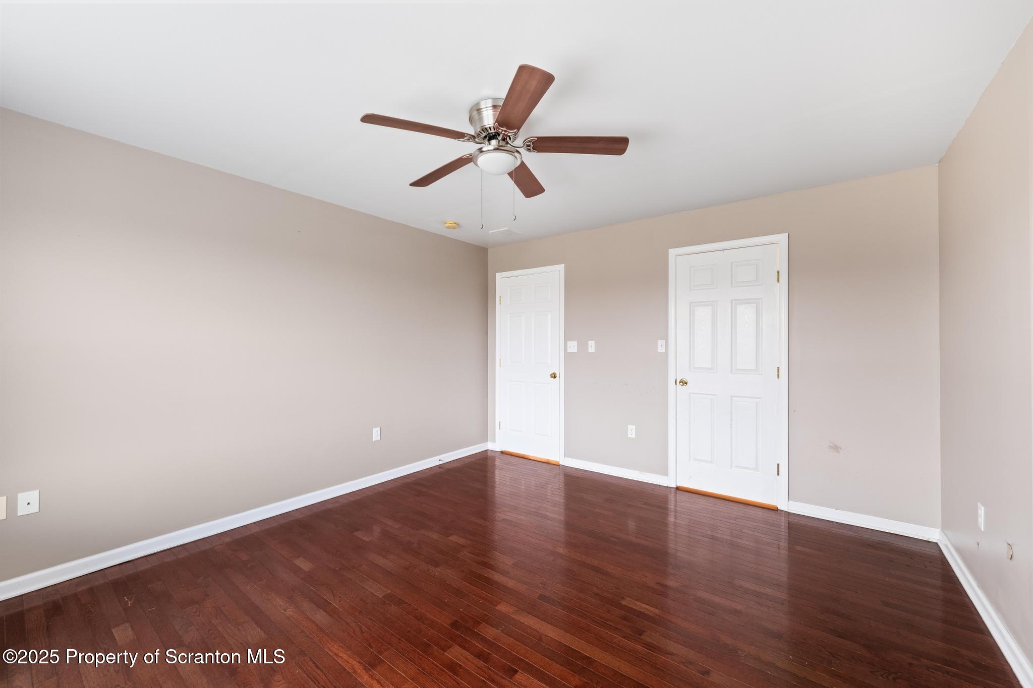 192 Shadow Wood Circle Archbald, PA 18403 - Photo 34 of 55 an empty room with wooden floor and windows