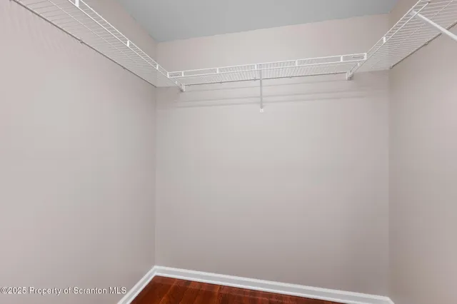 a view of hallway with wooden floor