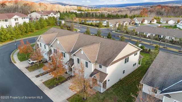 an aerial view of a house with a ocean view