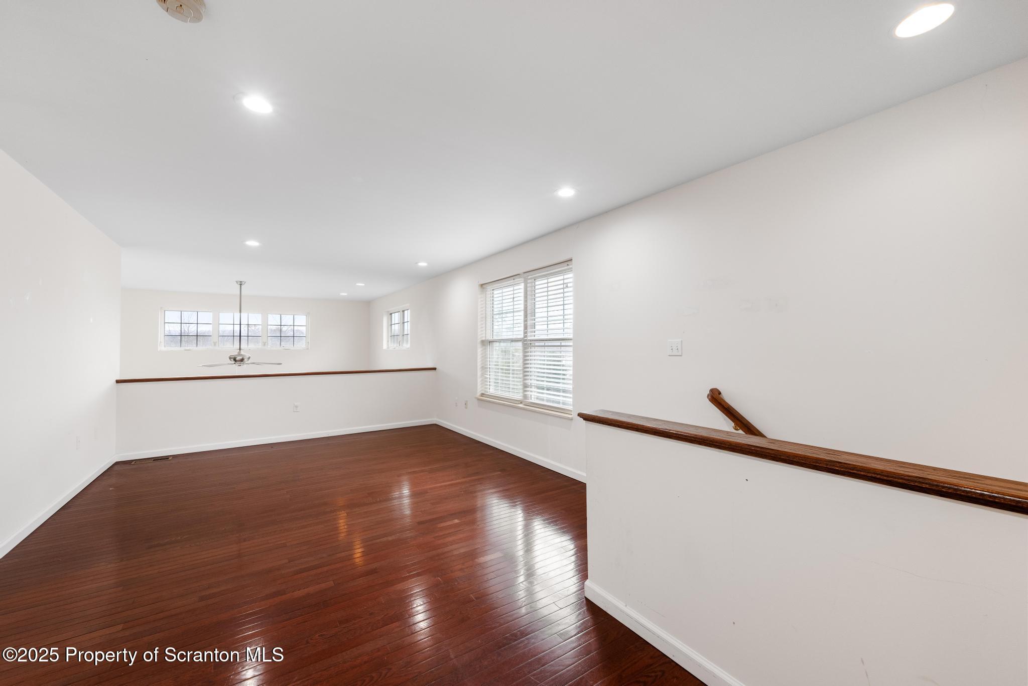 192 Shadow Wood Circle Archbald, PA 18403 - Photo 43 of 55 a view of empty room with wooden floor and fan