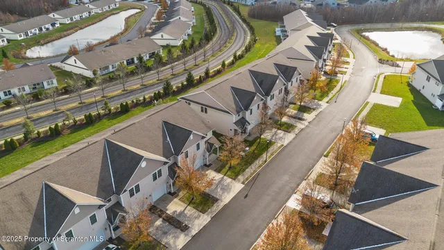 a city view from a balcony with outdoor seating