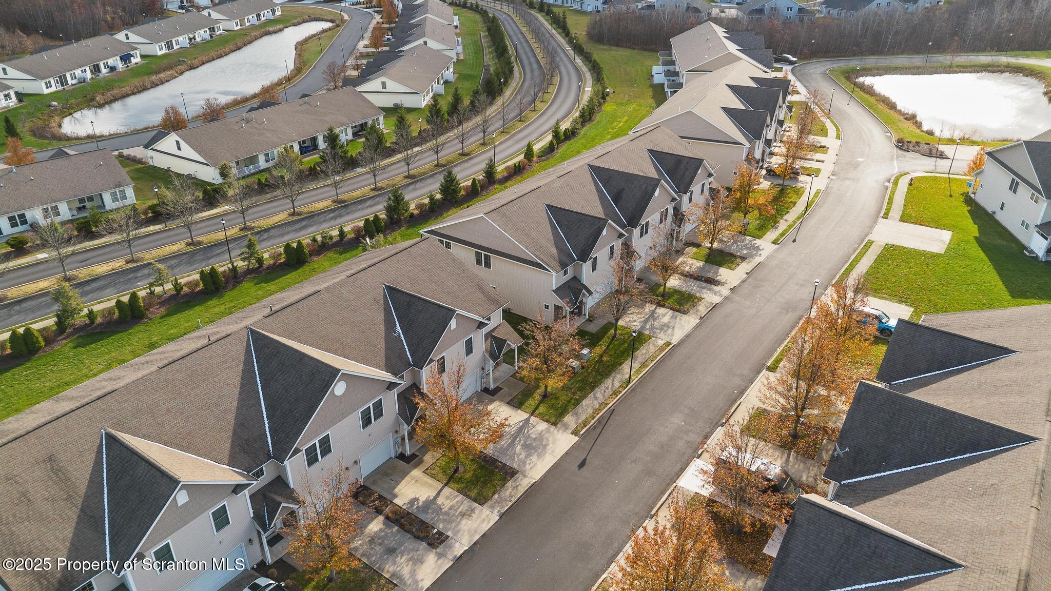 192 Shadow Wood Circle Archbald, PA 18403 - Photo 5 of 55 a city view from a balcony with outdoor seating