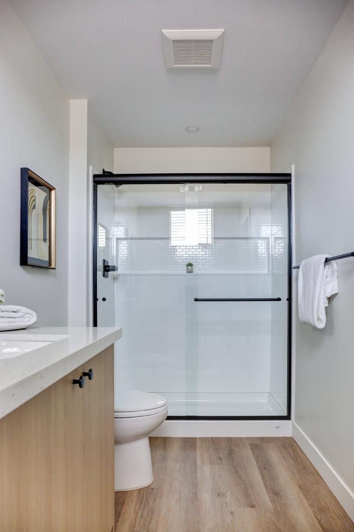 630 North Power Road, Unit 114 Mesa, AZ 85205 - Photo 9 of 11 a bathroom with a granite countertop sink toilet and shower