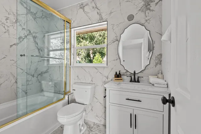 a spacious bedroom with a bed and a window