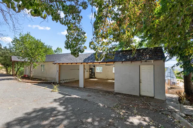 a view of a living room hardwood floor and a ceiling fan