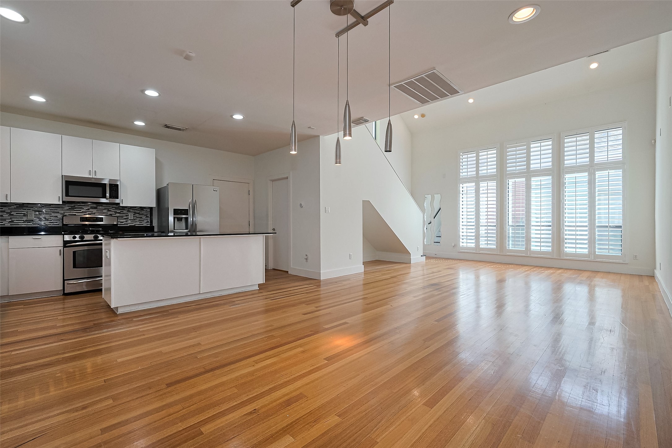 4331 Eigel Street Houston, TX 77007 - Photo 10 of 38 a view of kitchen with cabinets and wooden floor