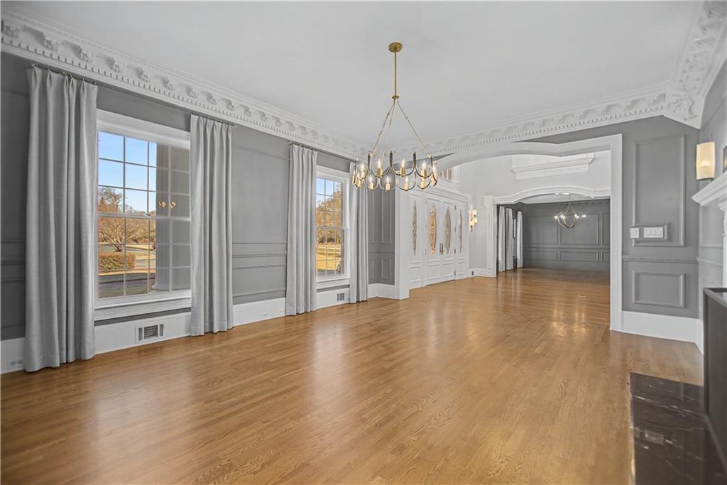 1445 Hillside Drive Southwest Grayson, GA 30017 - Photo 13 of 85 a view of a big room with chandelier and windows