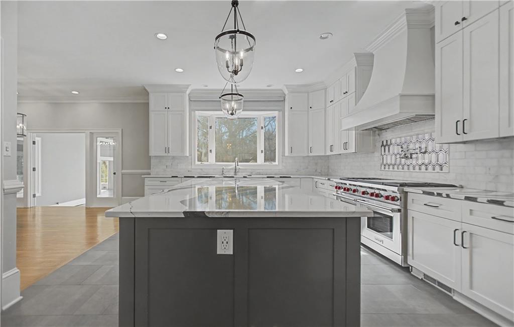 1445 Hillside Drive Southwest Grayson, GA 30017 - Photo 20 of 85 a kitchen with stainless steel appliances granite countertop a sink a stove and a refrigerator