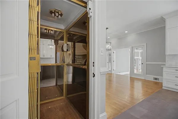 a view of a livingroom with wooden floor and a window