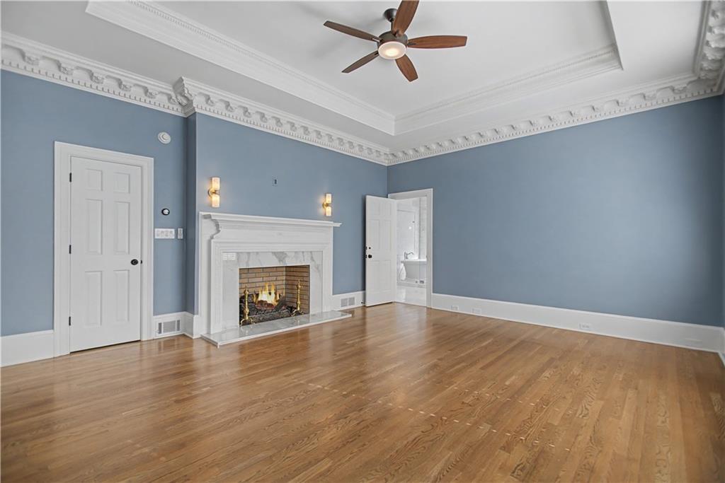 1445 Hillside Drive Southwest Grayson, GA 30017 - Photo 34 of 85 a view of an empty room with a fireplace and a window