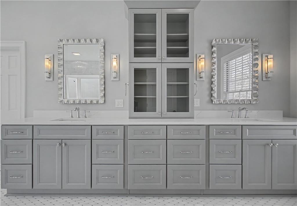 1445 Hillside Drive Southwest Grayson, GA 30017 - Photo 36 of 85 a bathroom with a sink double vanity and a mirror