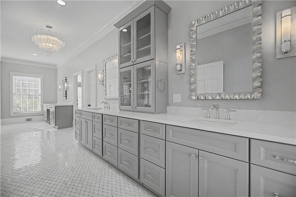 1445 Hillside Drive Southwest Grayson, GA 30017 - Photo 37 of 85 a spacious en suite bathroom with double sink and a mirror