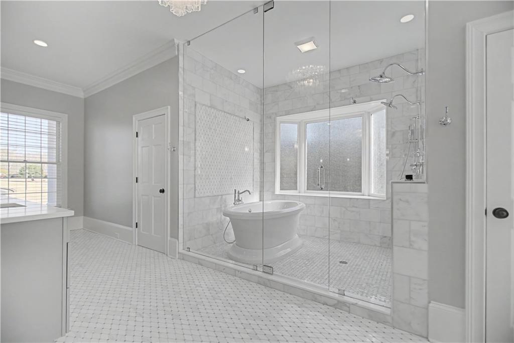 1445 Hillside Drive Southwest Grayson, GA 30017 - Photo 38 of 85 a bathroom with a shower and a sink