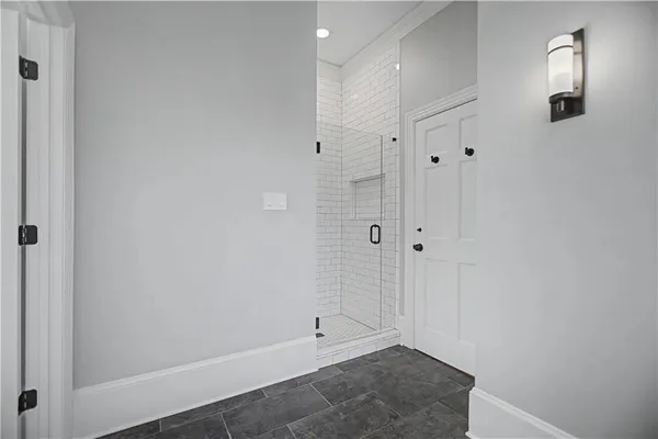a bathroom with a toilet sink double vanity and mirror