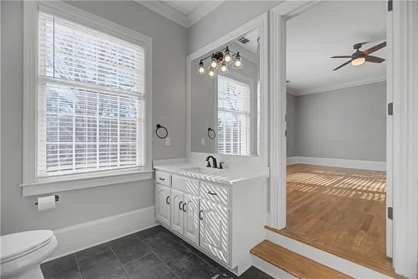 a view of a patio with table and chairs under an umbrella