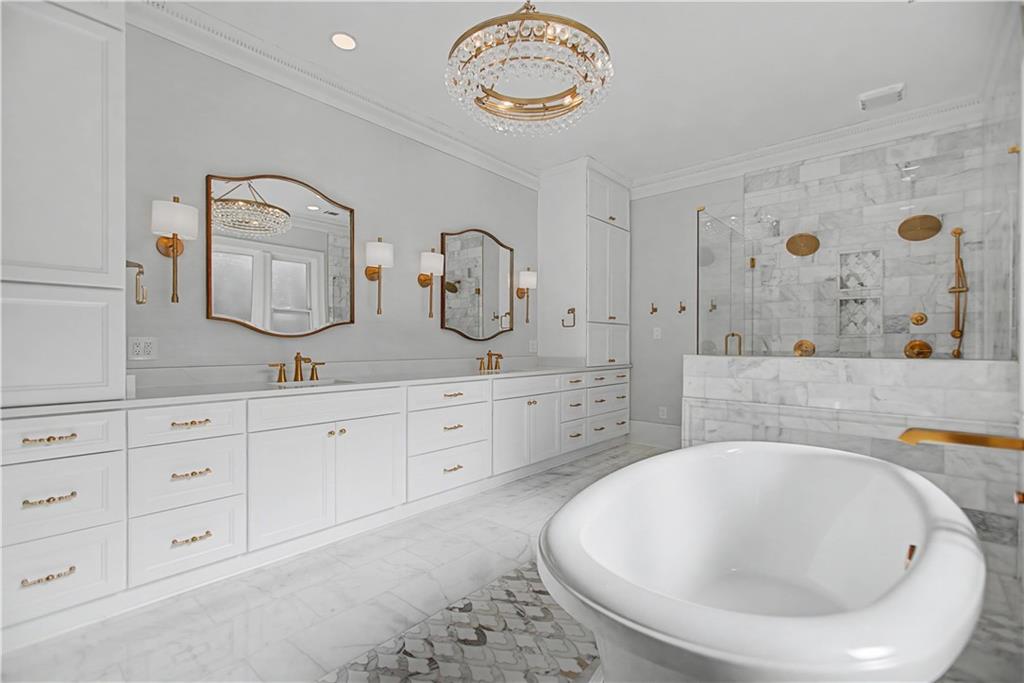 1445 Hillside Drive Southwest Grayson, GA 30017 - Photo 53 of 85 a spacious bathroom with double vanity sink and a mirror