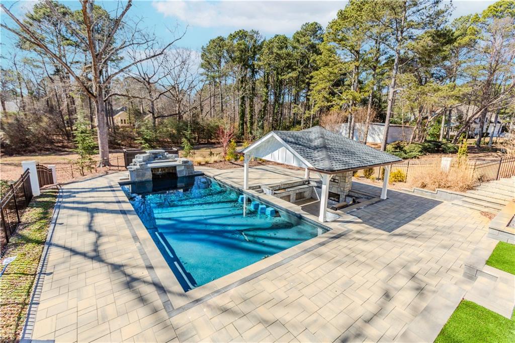 1445 Hillside Drive Southwest Grayson, GA 30017 - Photo 6 of 85 a view of a patio with chairs and a table
