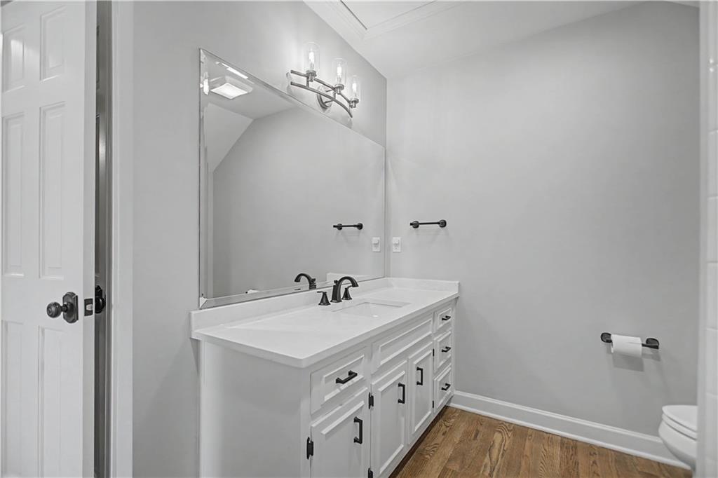 1445 Hillside Drive Southwest Grayson, GA 30017 - Photo 63 of 85 a bathroom with a sink and mirror