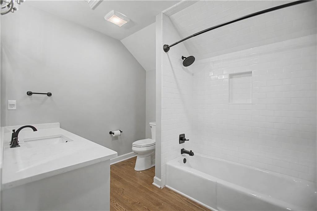 1445 Hillside Drive Southwest Grayson, GA 30017 - Photo 64 of 85 a bathroom with a bathtub a toilet and a sink