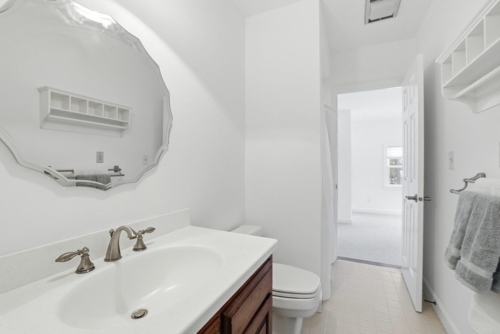 74 Branch Street, Unit 15 Scituate, MA 02066 - Photo 15 of 26 a bathroom with a sink toilet and shower