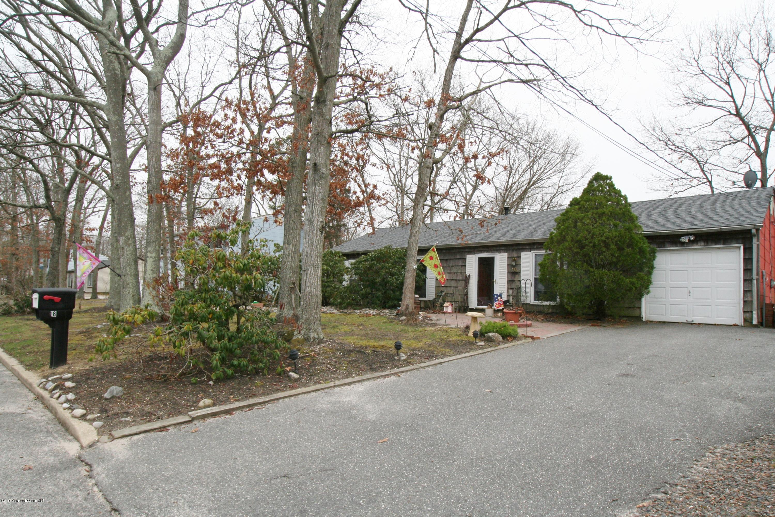 18 Cranmer Road Bayville, NJ 08721 - Photo 1 of 14 a view of a house with a street and trees