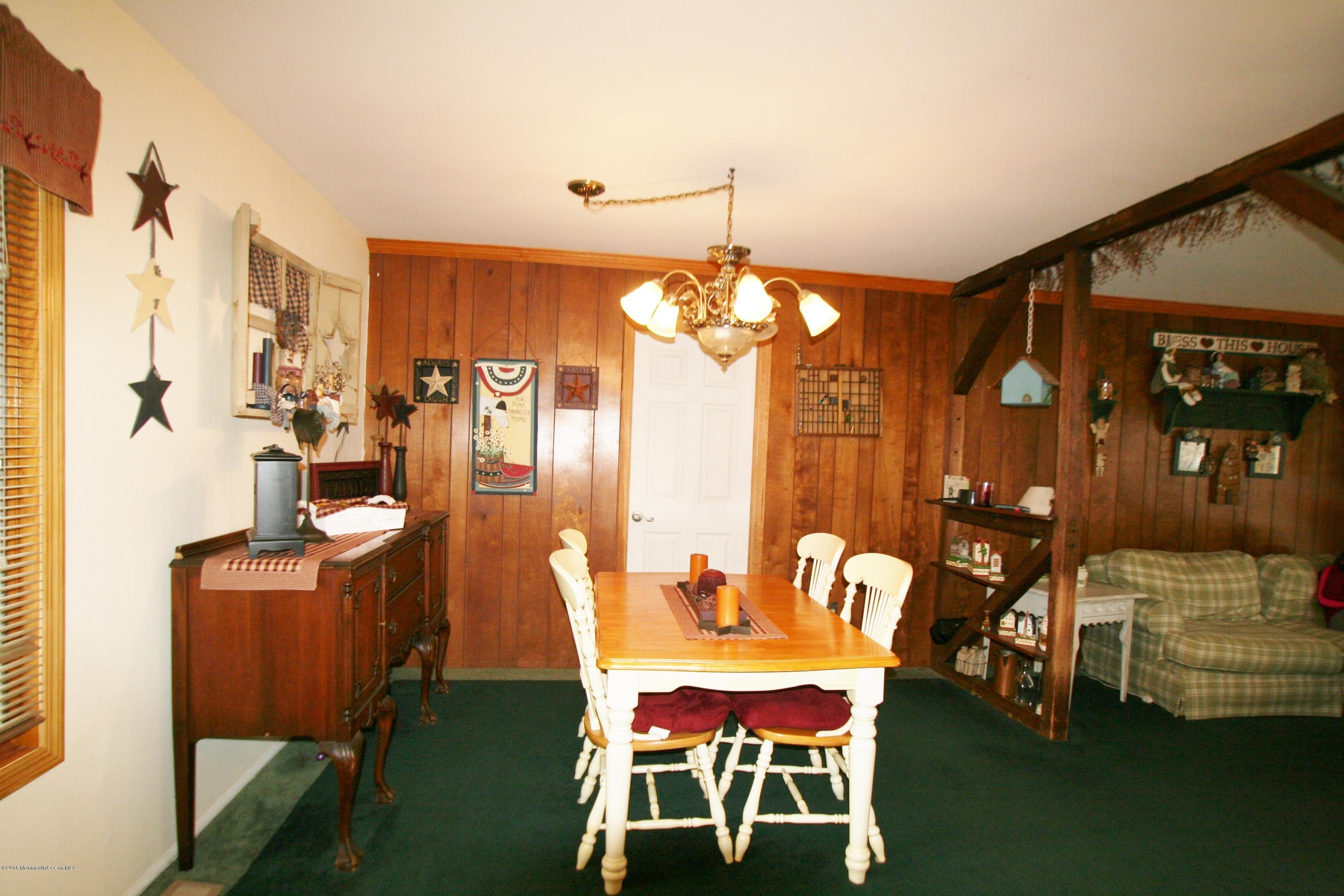 18 Cranmer Road Bayville, NJ 08721 - Photo 12 of 14 a dining room with furniture and chandelier kitchen view