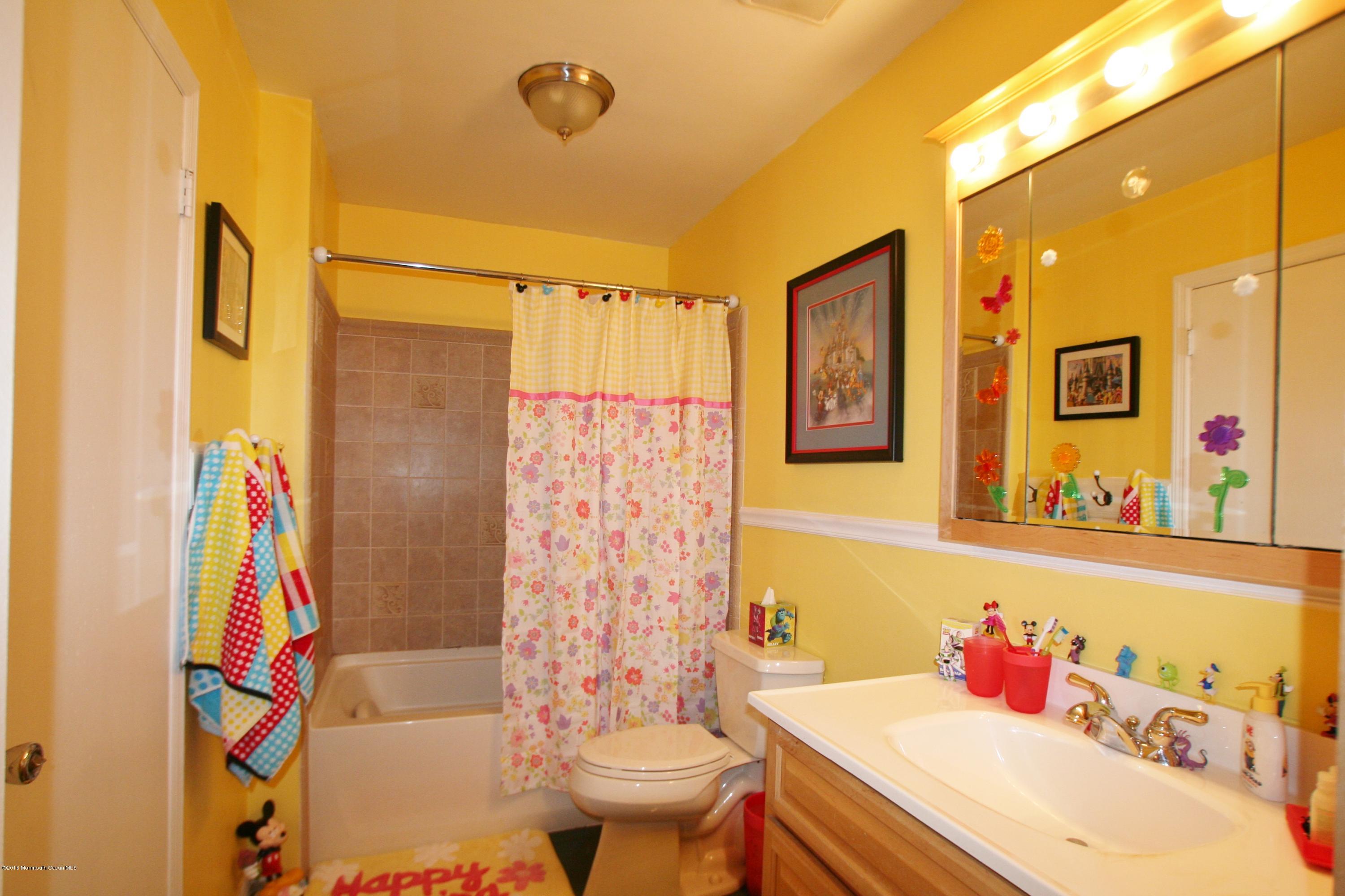 18 Cranmer Road Bayville, NJ 08721 - Photo 14 of 14 a bathroom with a sink toilet and shower