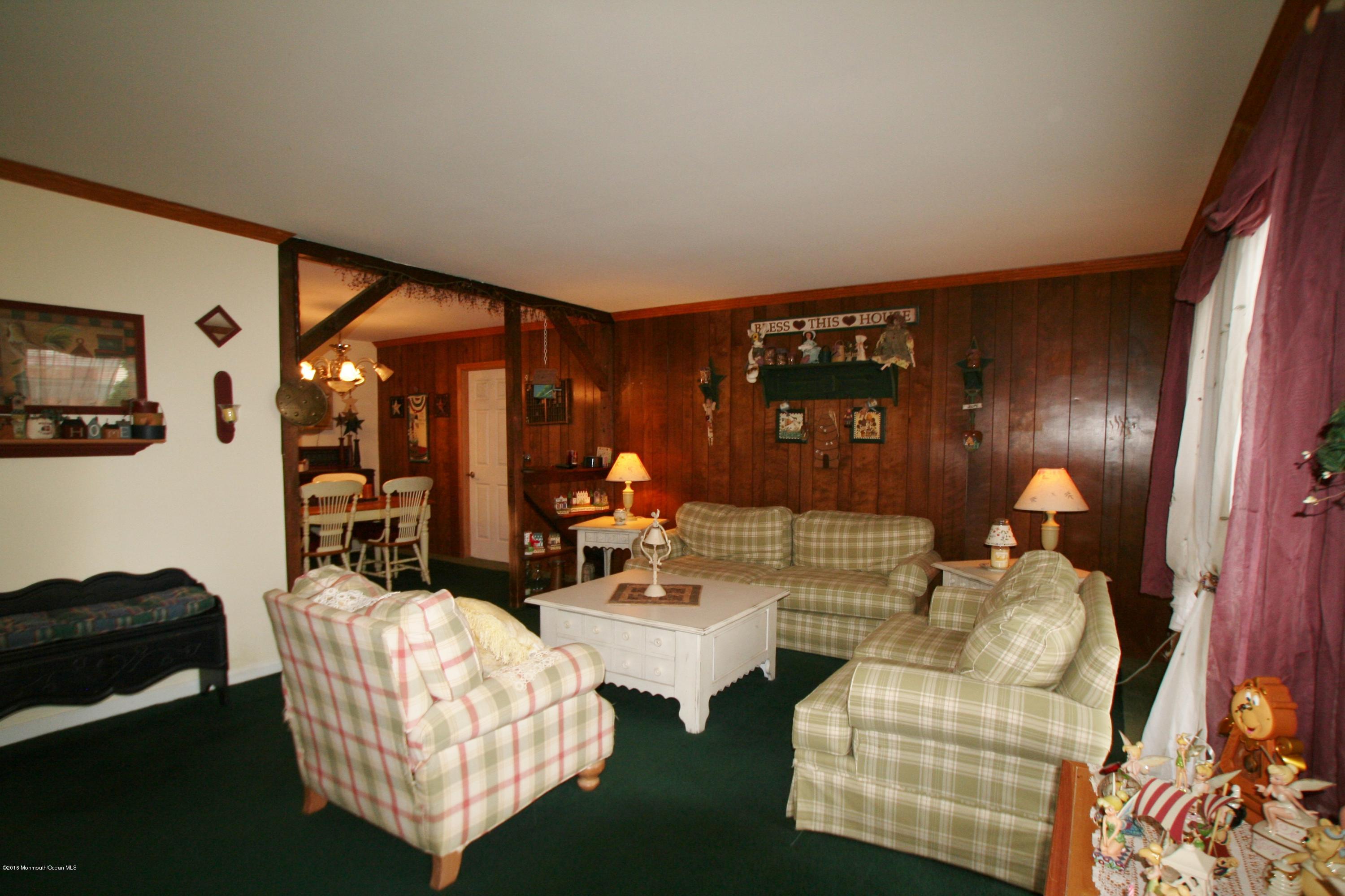 18 Cranmer Road Bayville, NJ 08721 - Photo 3 of 14 a living room with furniture a lamp wooden floor and a large window