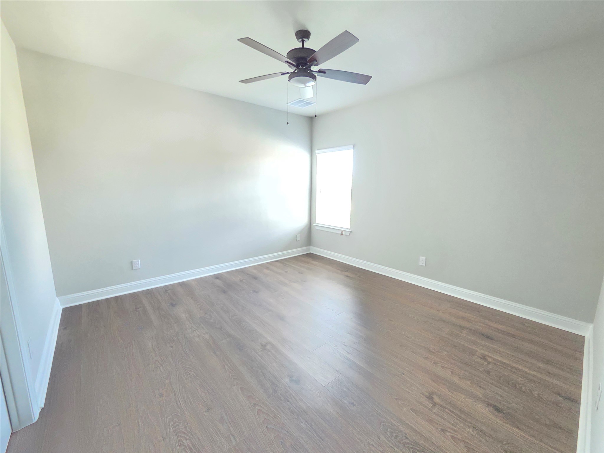 600 C-Bar Ranch Trail, Unit 121 Cedar Park, TX 78613 - Photo 21 of 32 Well-appointed bedroom with generous light and a practical ceiling fan.